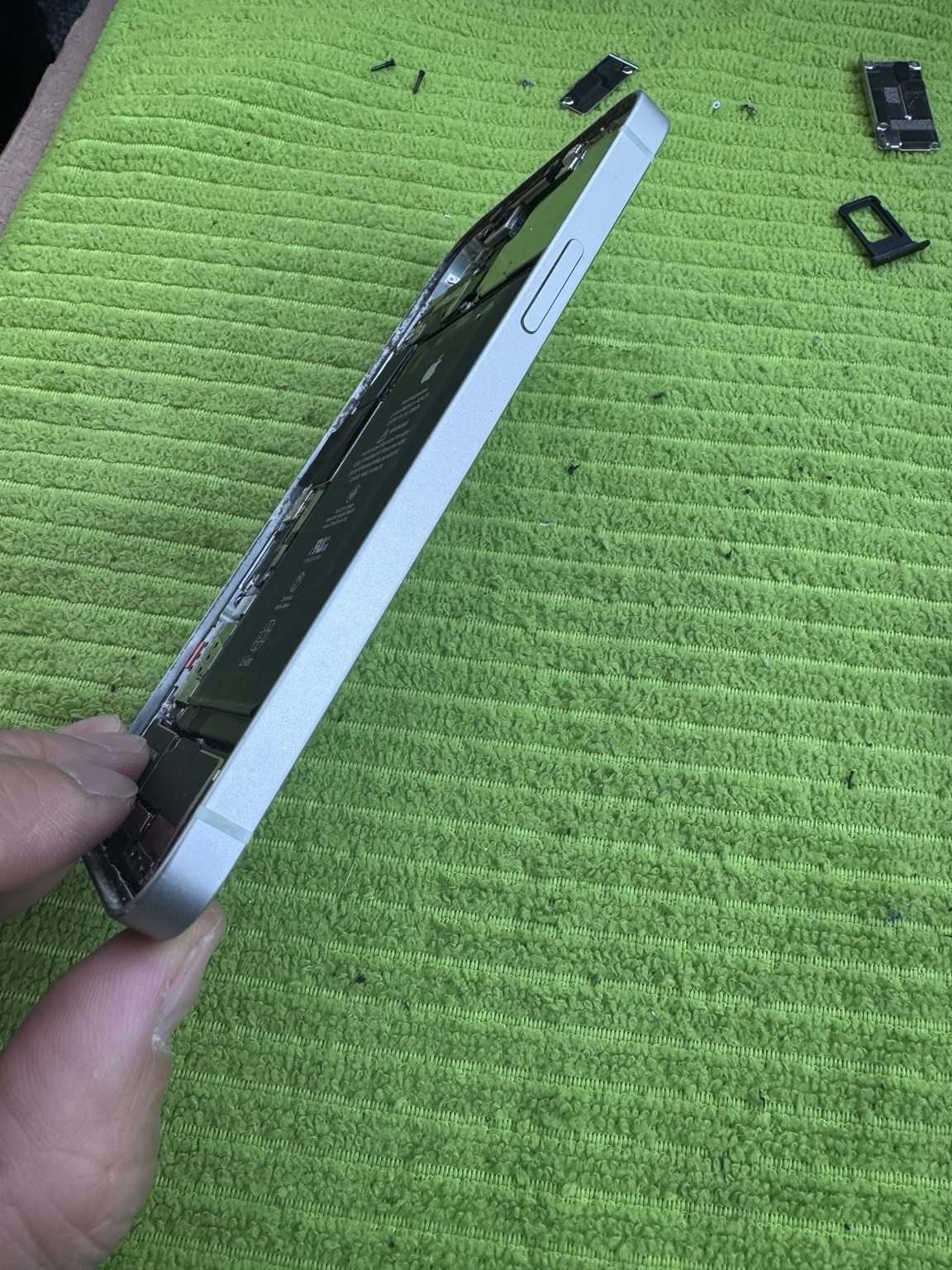 iPhone 12 replacement frame and internal components during repair