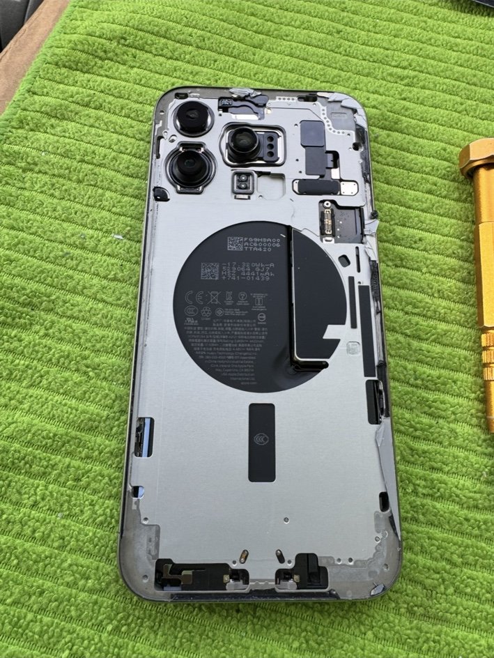iPhone 15 Pro Max with broken back glass removed