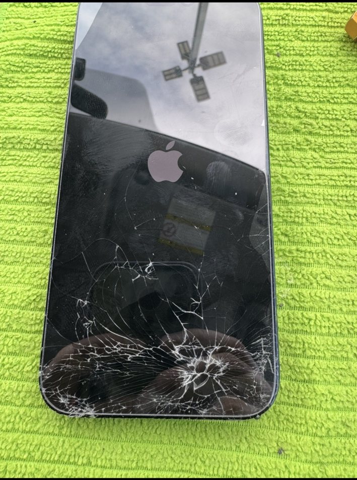 iPhone 17 Pro Max cracked screen before mobile screen replacement at a car dealership in Greenview Industrial Park NE Calgary