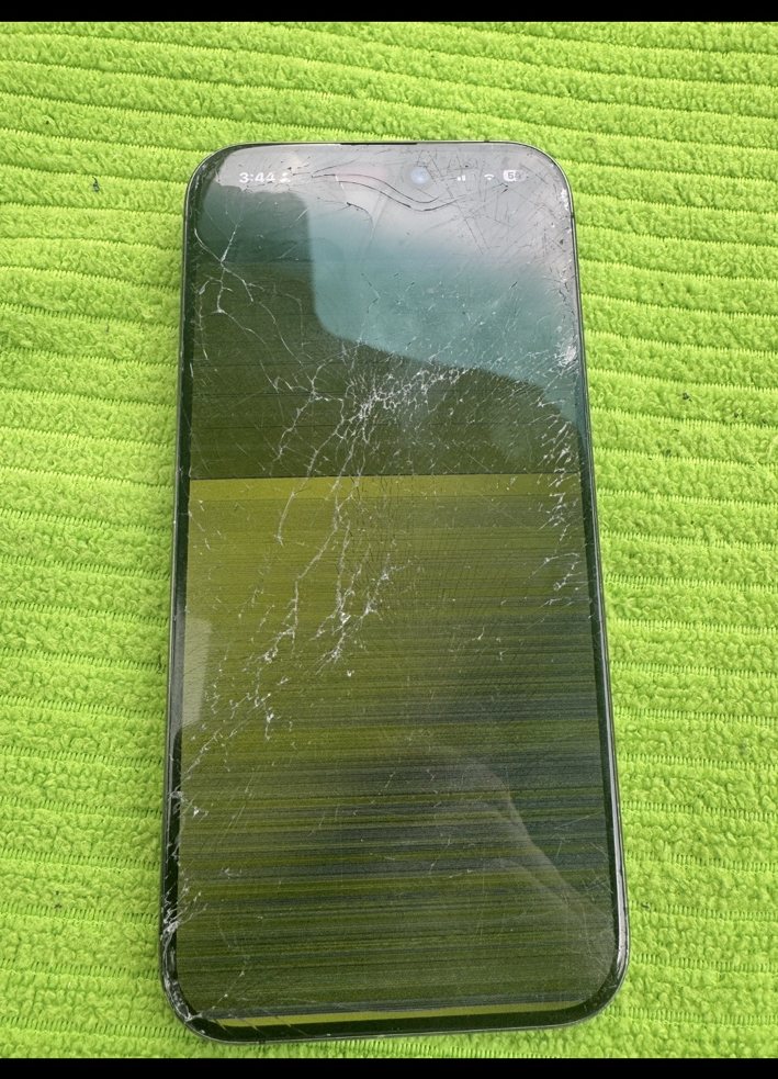 Cracked iPhone 15 Pro front screen with display damage before repair in NE Calgary